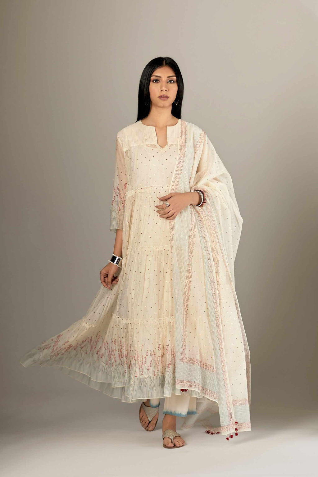 Multi-tiered hand block printed kurta set detailed with an all-over quilted and printed yoke
