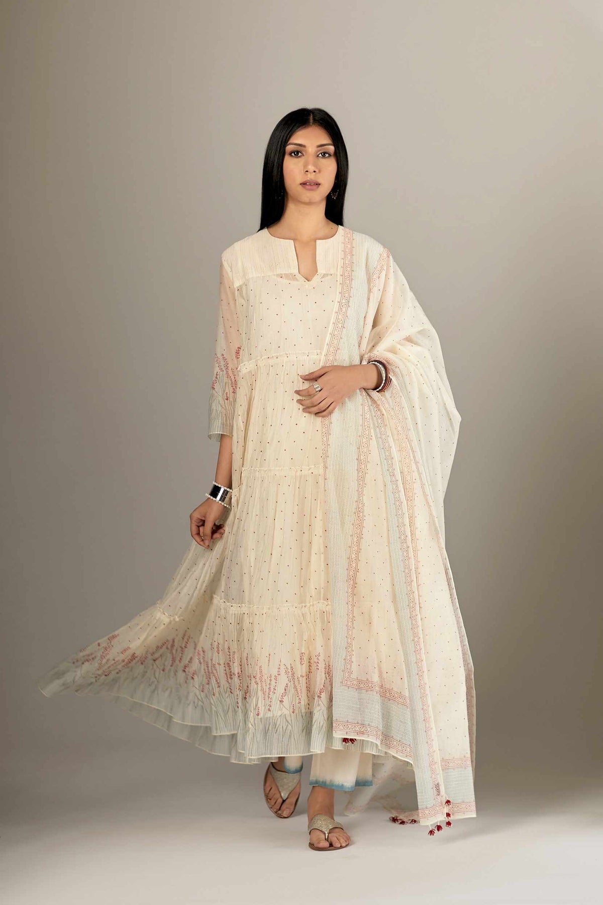 Multi-tiered hand block printed kurta set detailed with an all-over quilted and printed yoke