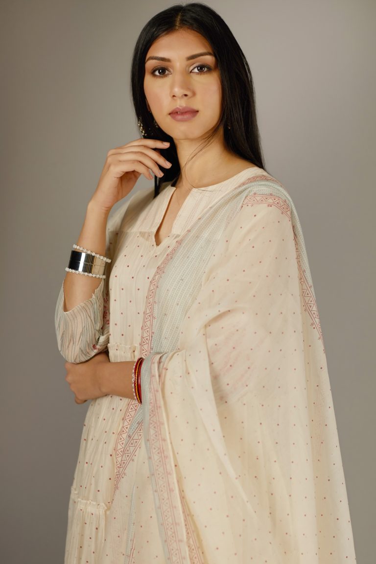 Multi-tiered hand block printed kurta set detailed with an all-over quilted and printed yoke