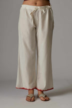 Off white straight pant with hand block print at the bottom