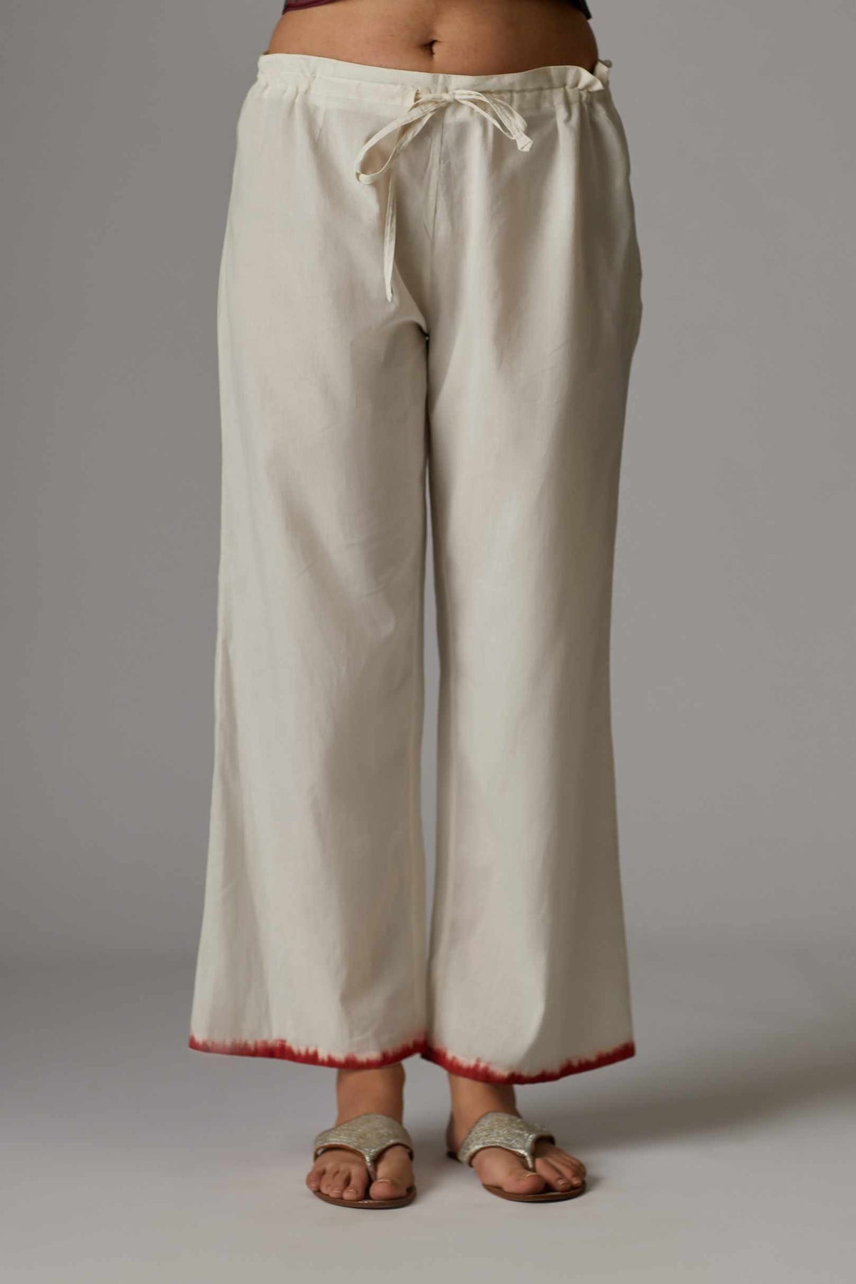 Off white straight pant with hand block print at the bottom