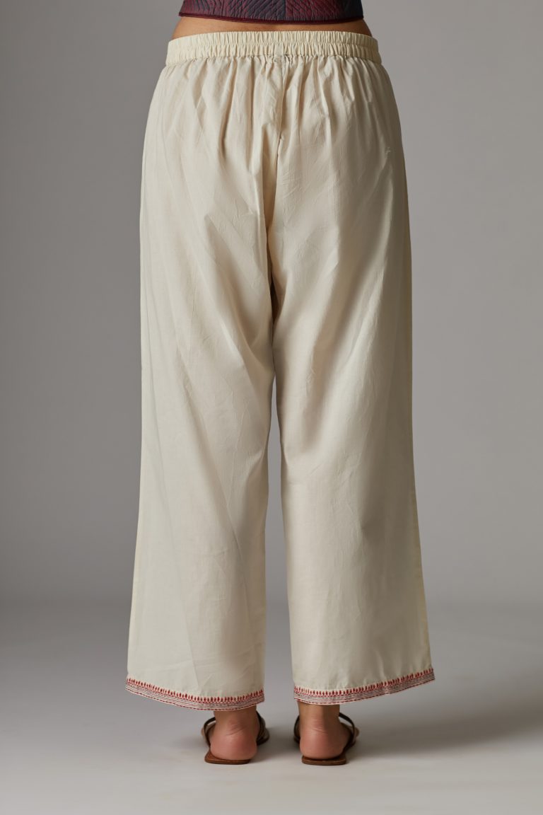 Off white straight pant with contrast thread embroidered hem