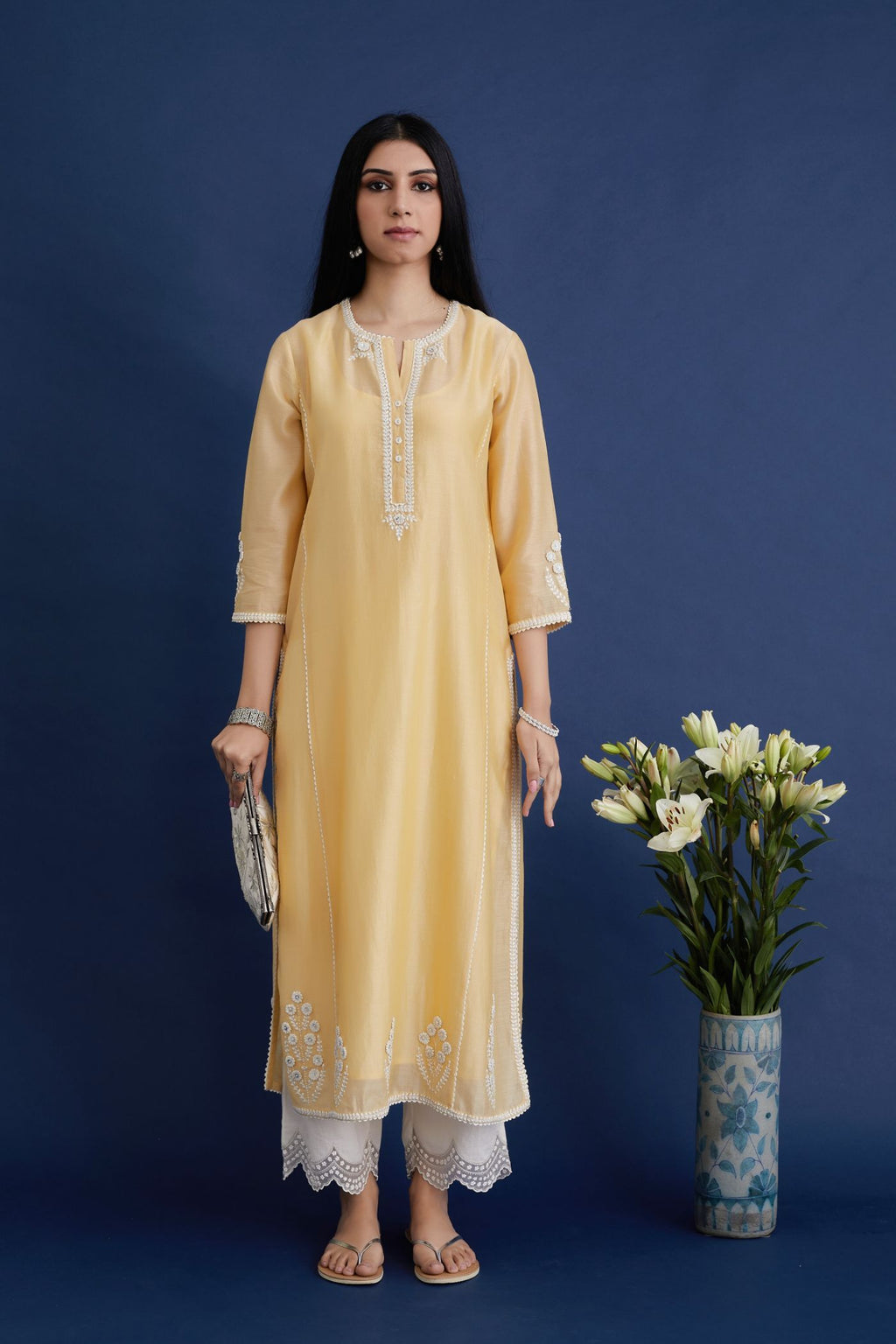 Yellow straight kurta set with off white embroidery and button placket neckline in front