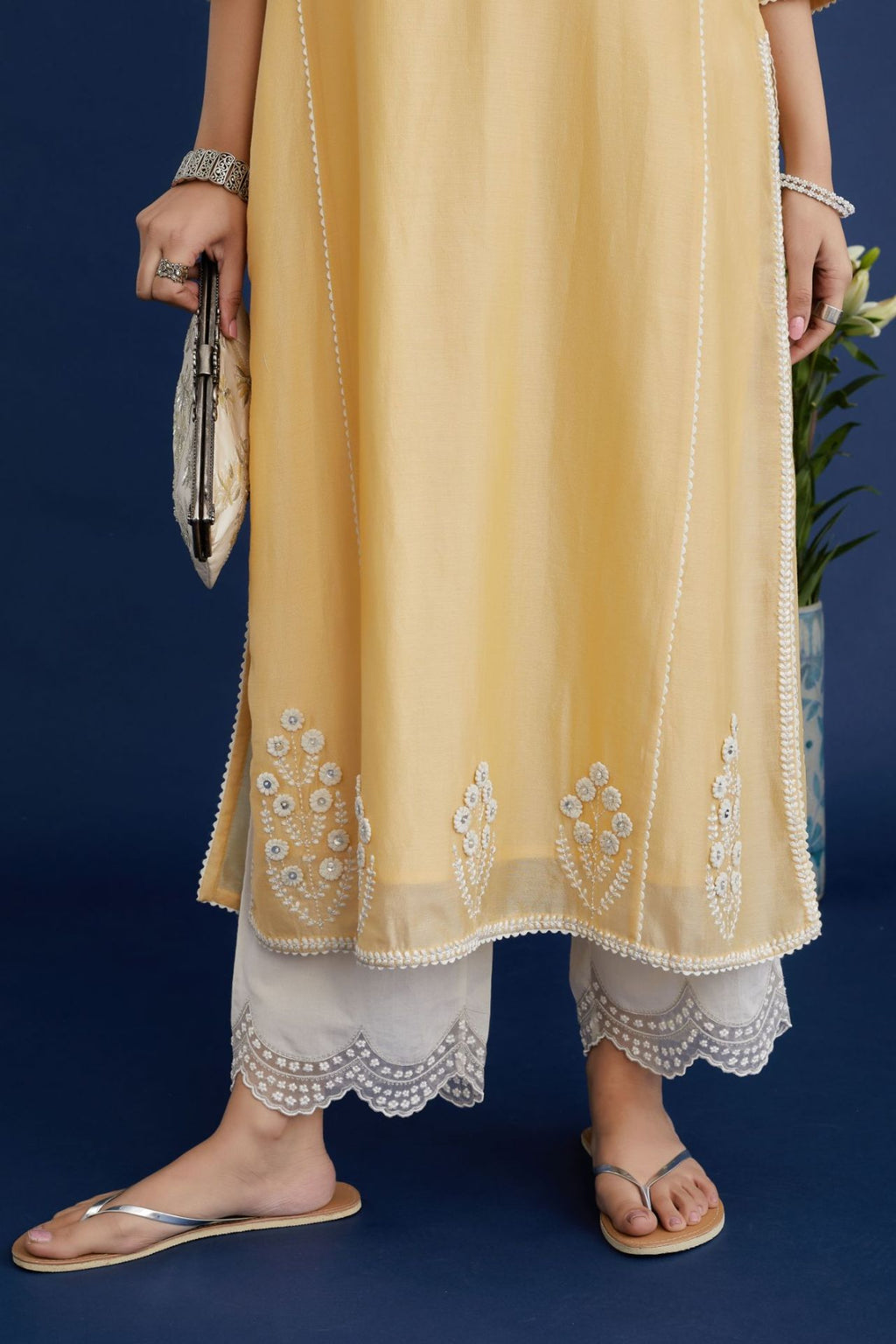 Yellow straight kurta set with off white embroidery and button placket neckline in front