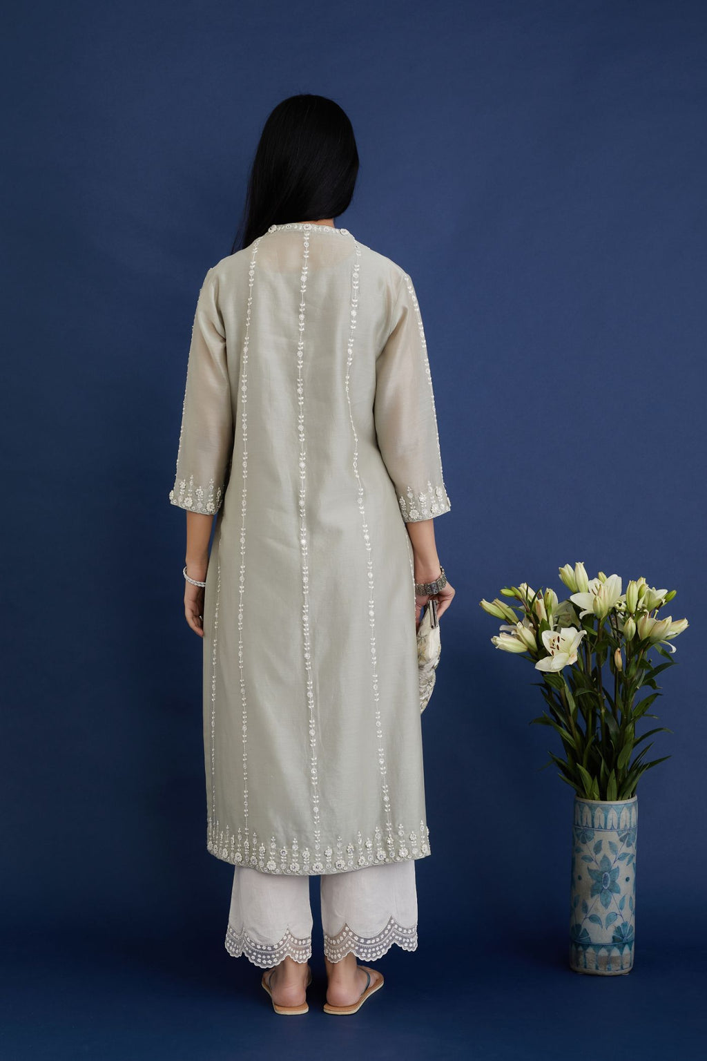 Dusty sage green silk chanderi straight kurta set with all-ovre contrast thread embroidery, highlighted with sequins hand work