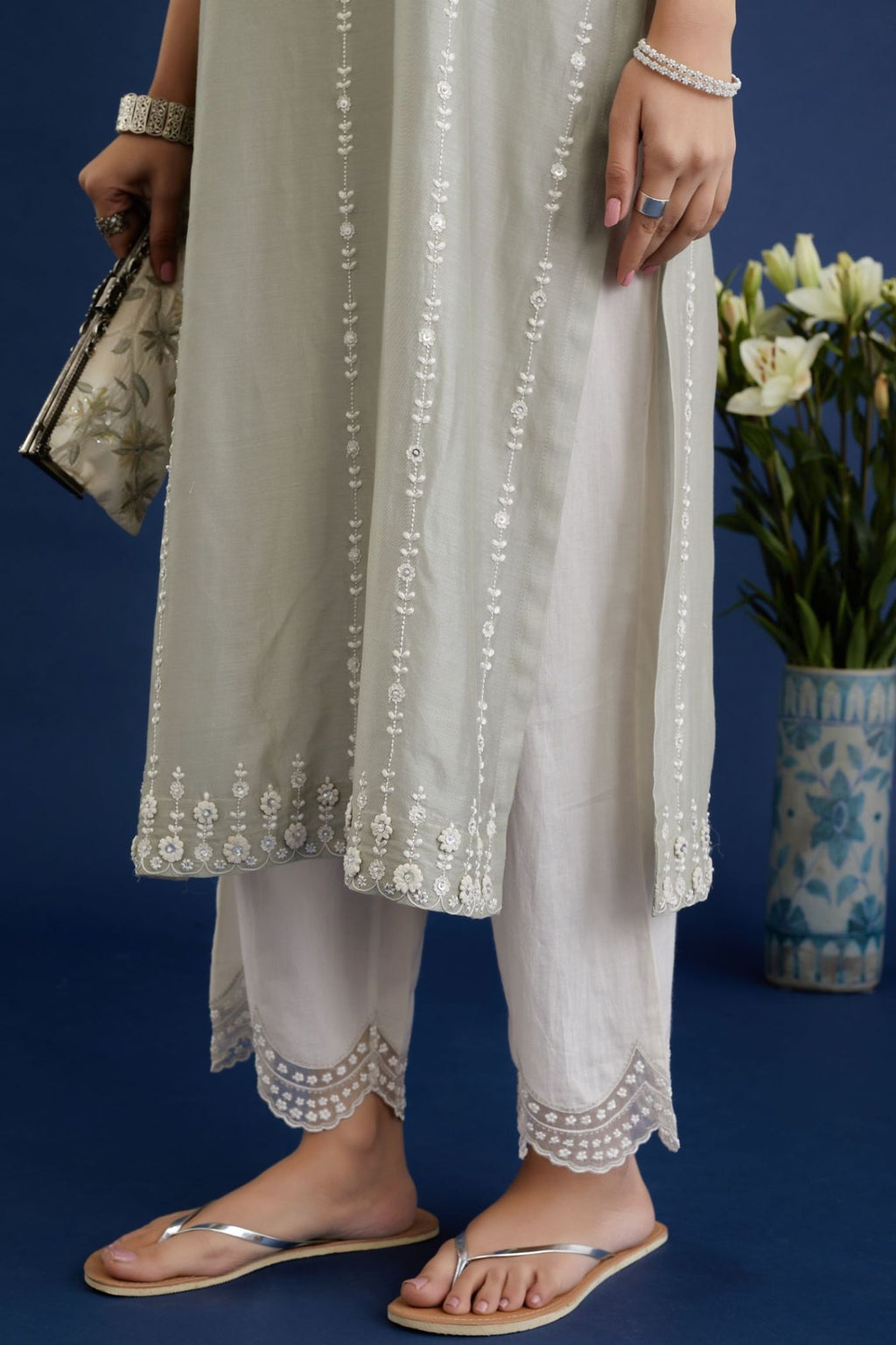 Dusty sage green silk chanderi straight kurta set with all-ovre contrast thread embroidery, highlighted with sequins hand work