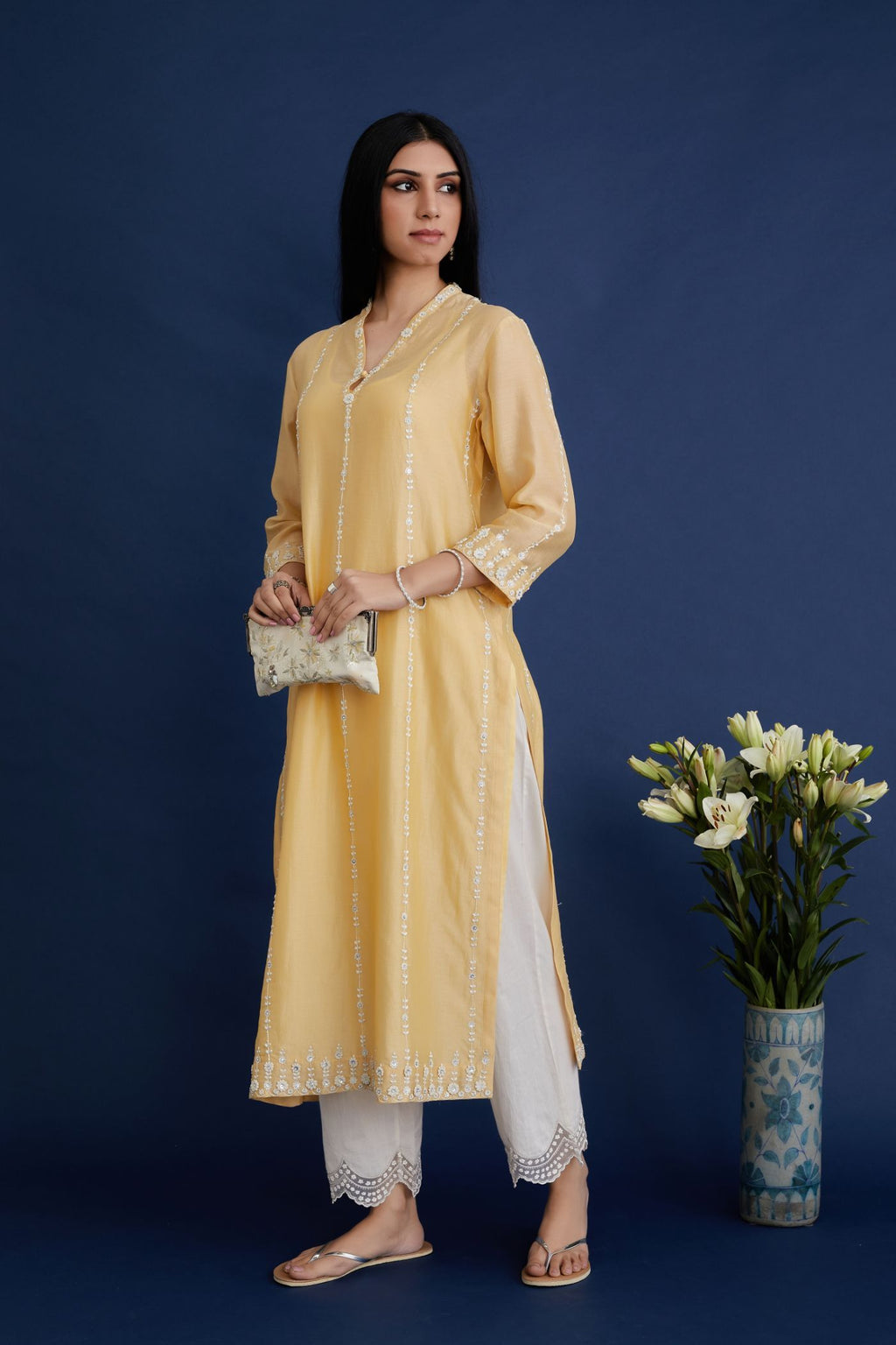 Yellow silk chanderi straight kurta set with all-ovre contrast thread embroidery, highlighted with sequins hand work