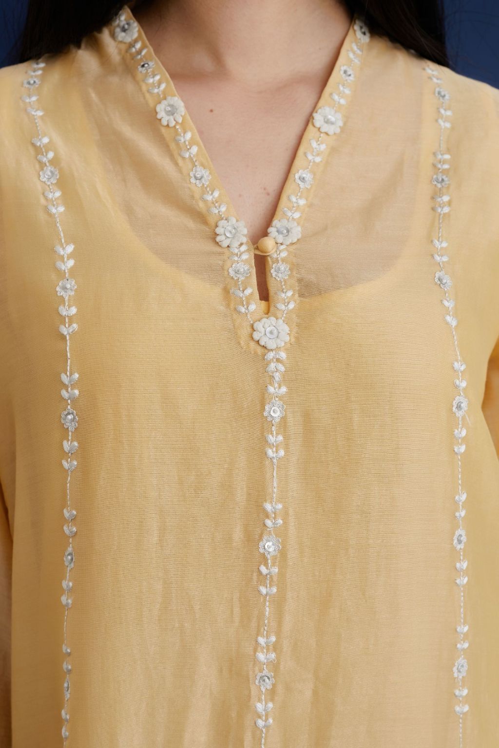 Yellow silk chanderi straight kurta set with all-ovre contrast thread embroidery, highlighted with sequins hand work