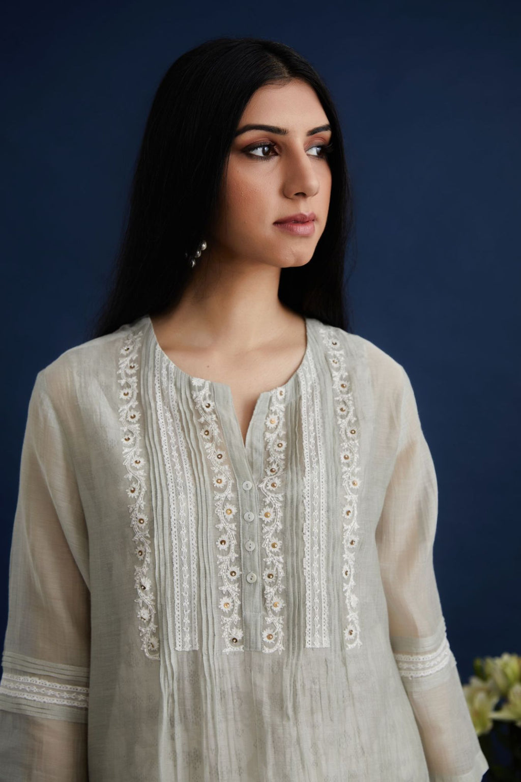 Double layered cotton chanderi kurta set with lace and pintucks detailing and hand block printed cotton slip inside