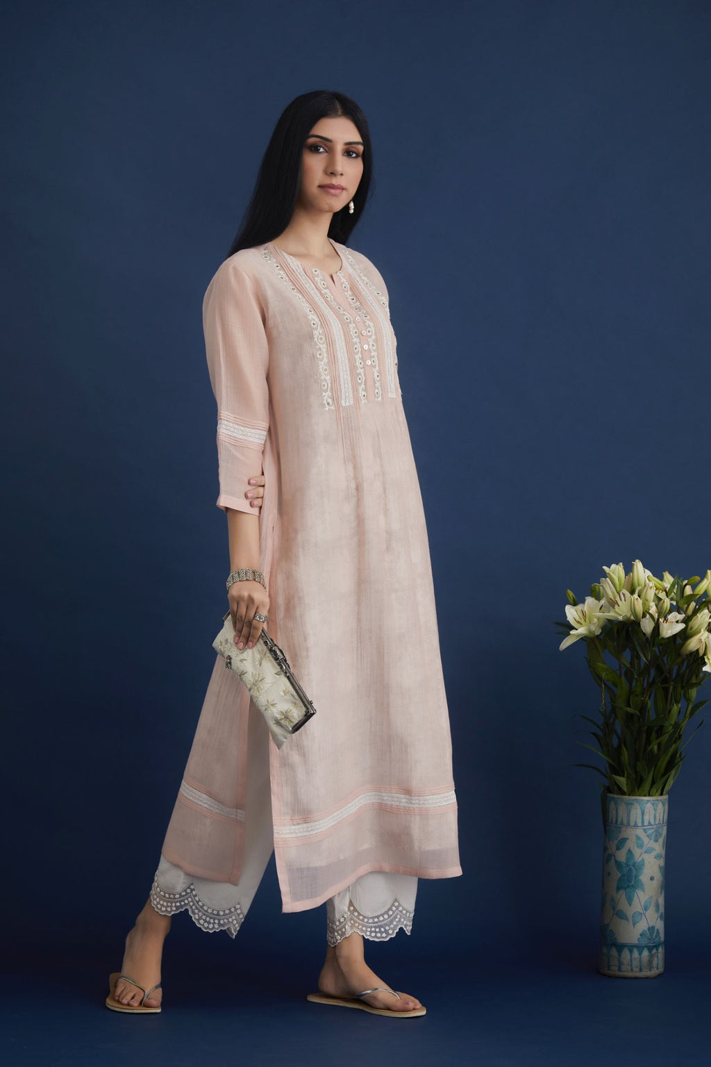 Double layered cotton chanderi kurta set with lace and pintucks detailing and hand block printed cotton slip inside