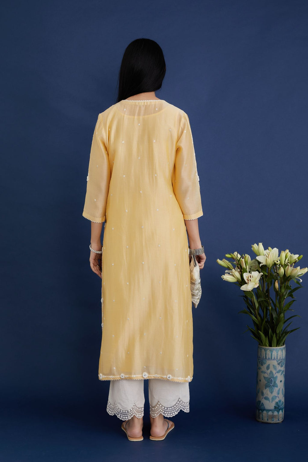 Silk chanderi straight kurta set with all-over contrast thread embroidery, highlighted with sequins hand work