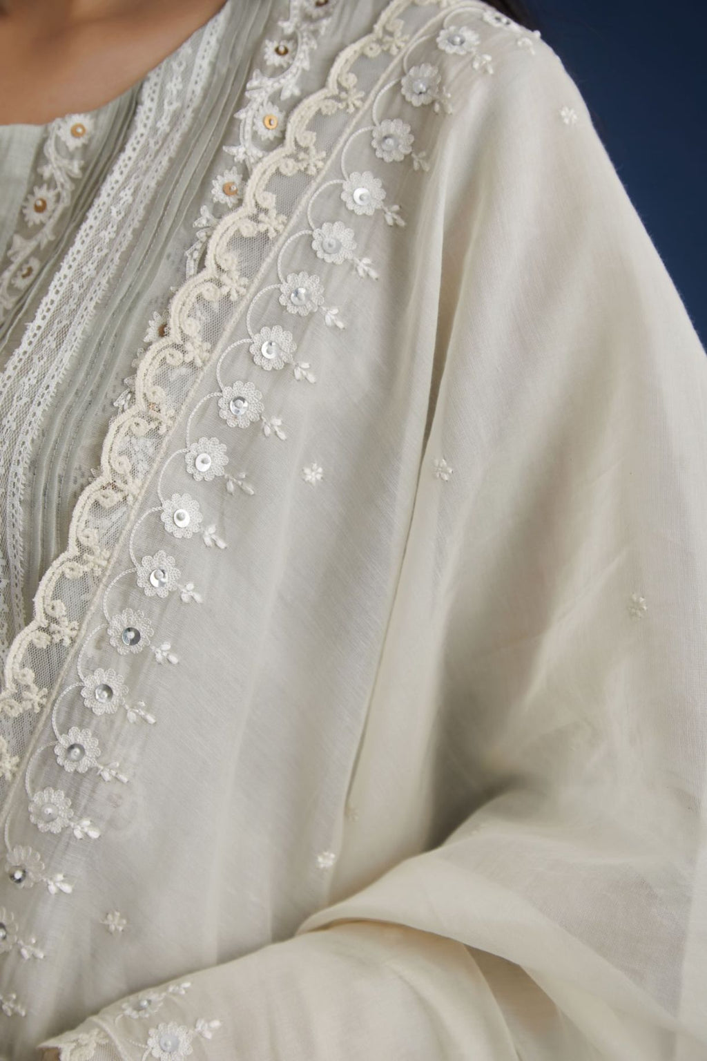 Off white cotton chanderi dupatta with all-over embroidery & edges are finished with lace, highlighted with sequins hand work