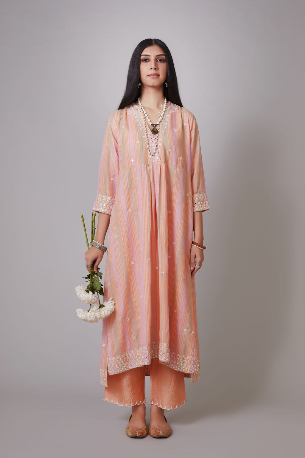 Multi striped hand block printed crushed silk kurta set with mirror hand work and quilted embroidery.