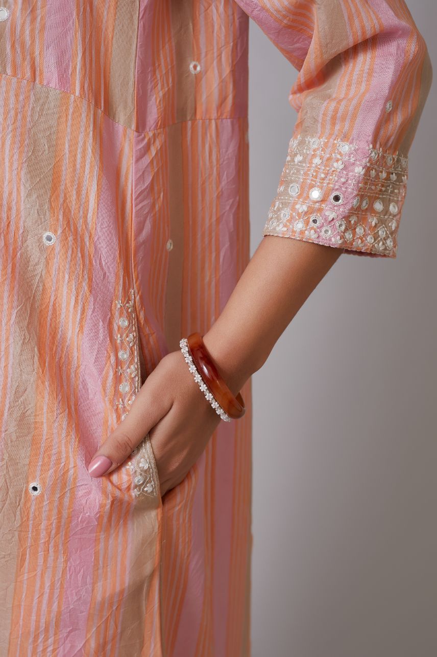 Multi striped hand block printed crushed silk kurta set with mirror hand work and quilted embroidery.