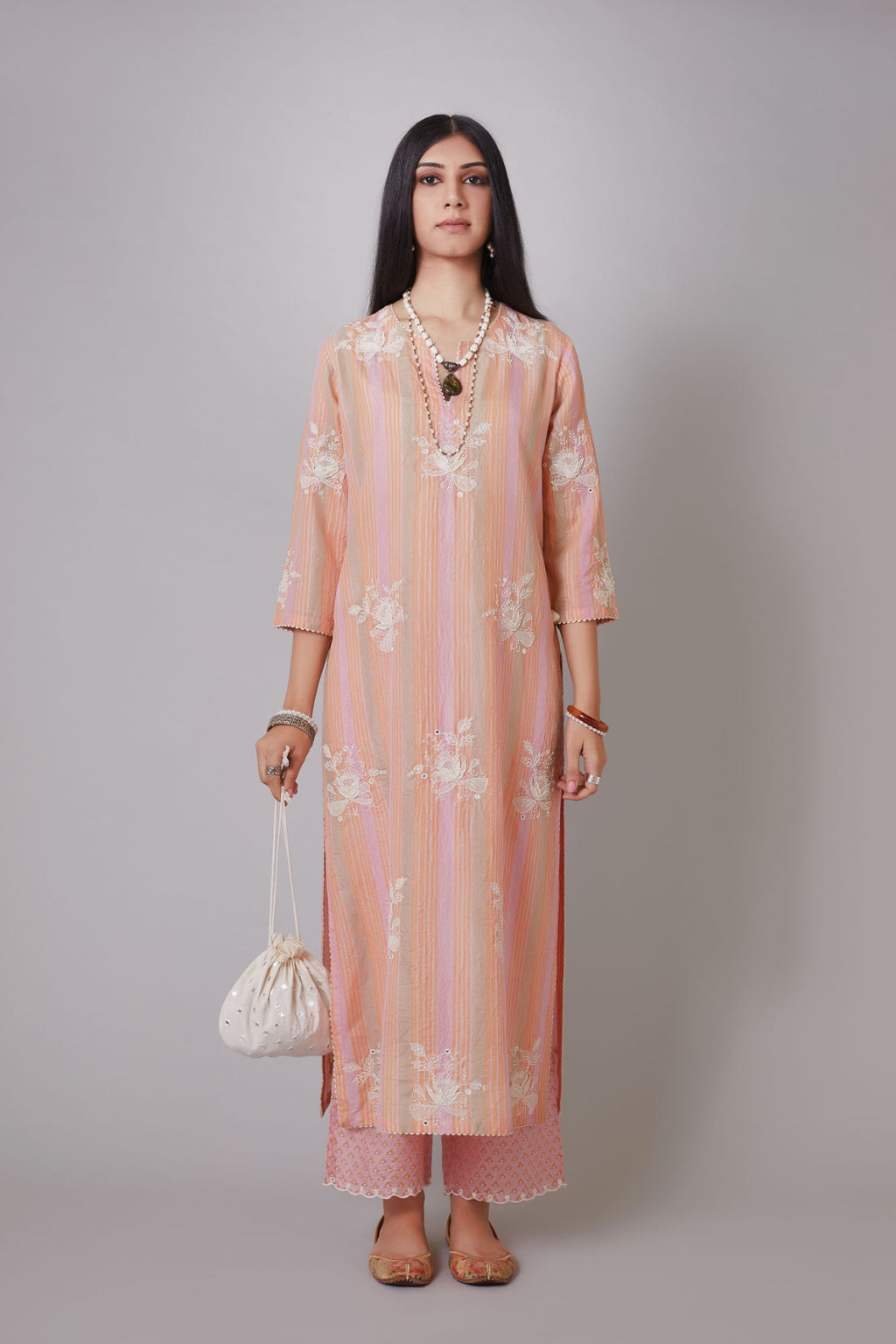 Multi striped hand crushed silk kurta set with raised flower embroidery, highlighted with mirror hand work.