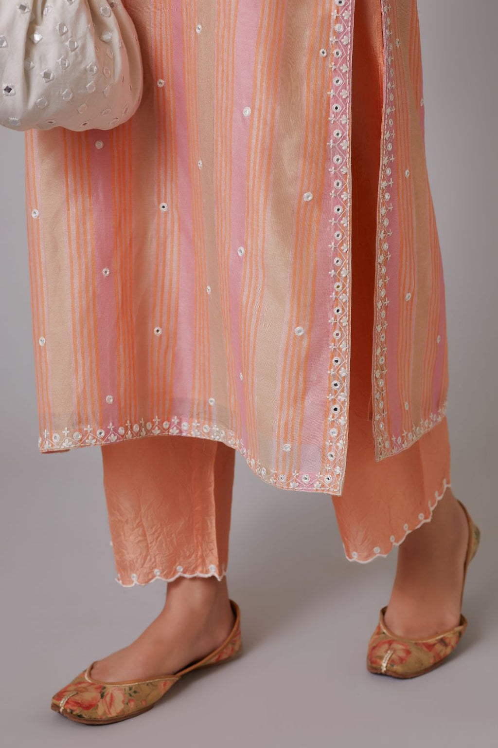 Multi striped hand block printed silk Chanderi kurta set highlighted with mirror hand work.