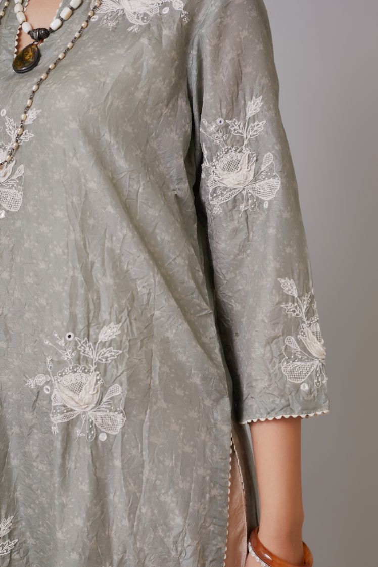 Blue hand block printed crushed silk kurta set with raised flower embroidery, highlighted with mirror hand work.