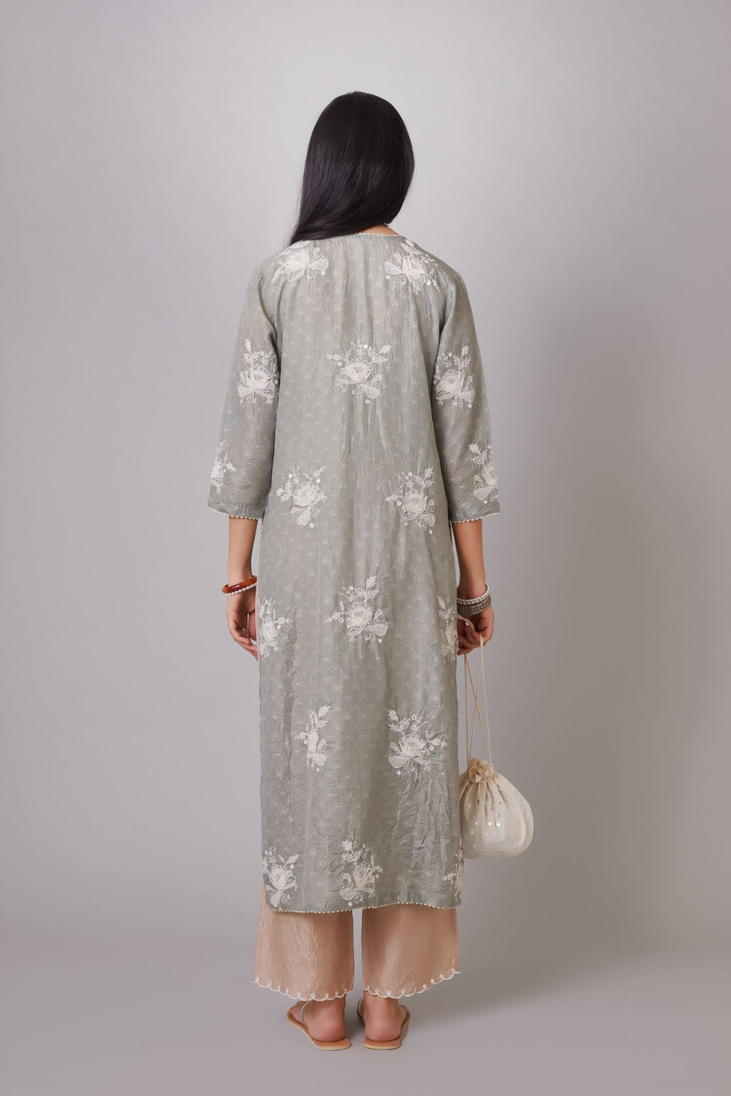 Blue hand block printed crushed silk kurta set with raised flower embroidery, highlighted with mirror hand work.