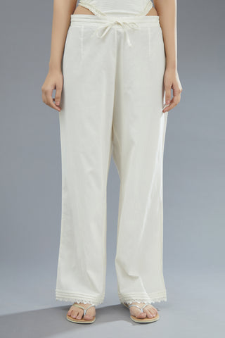 Off white straight pants finished with pin tucks and lace detailing at hem (PANTS)
