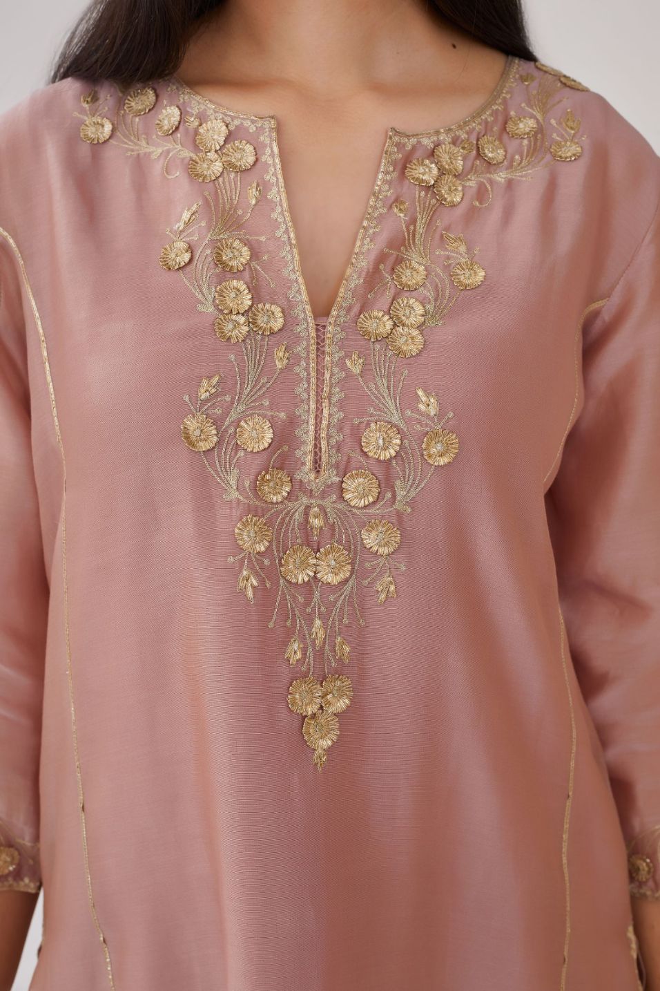 Lilac silk chanderi kurta with gota embroidered neckline and hem, paired with lilac straight pants with gota and silk chanderi fabric detaling at bottom hem