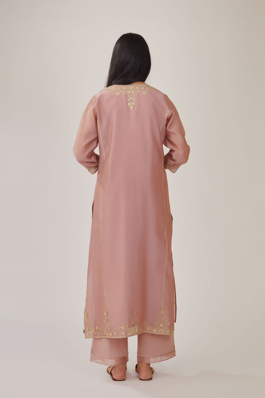 Lilac silk chanderi kurta with gota embroidered neckline and hem, paired with lilac straight pants with gota and silk chanderi fabric detaling at bottom hem