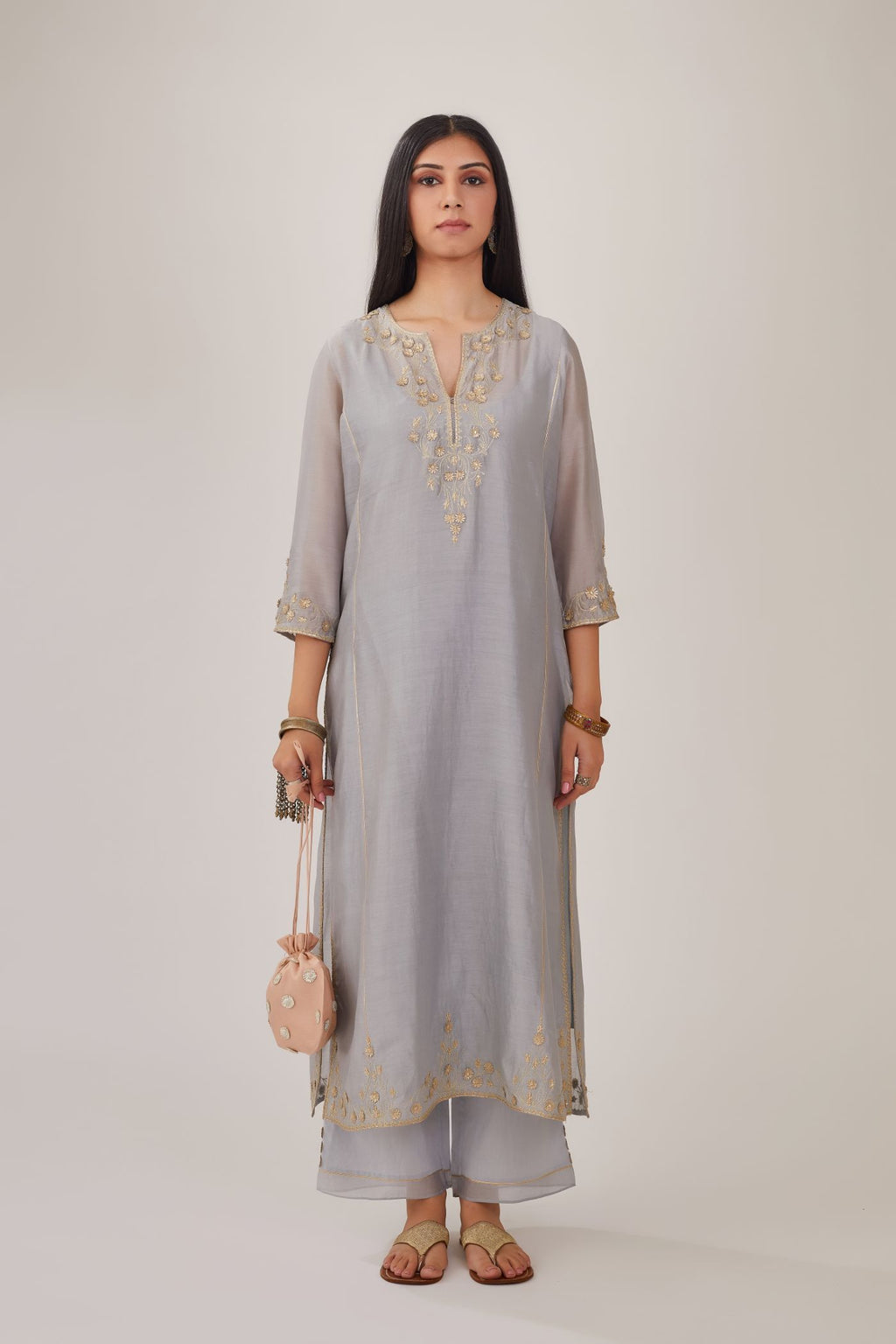 Steel blue silk chanderi kurta with gota embroidered neckline and hem, paired with steel blue straight pants with gota and silk chanderi fabric detaling at bottom hem