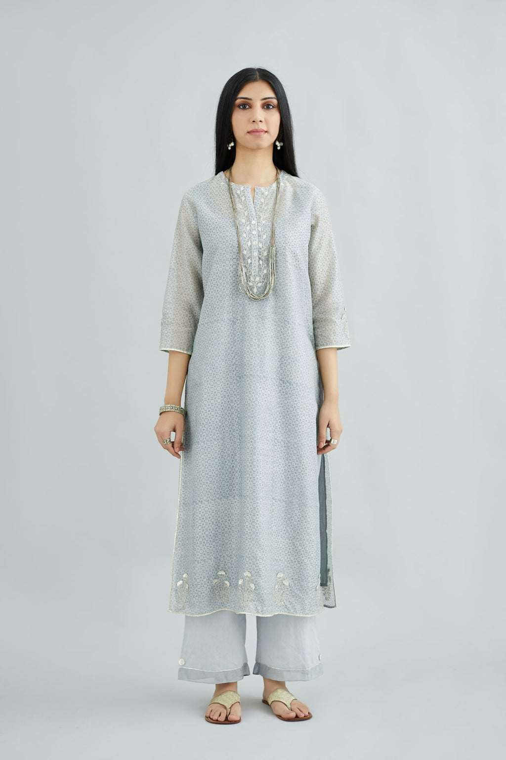 Steel blue hand block printed silk chanderi kurta with silver gota embroidery, paired with steel blue straight pants with gota and silk chanderi fabric detaling at bottom hem