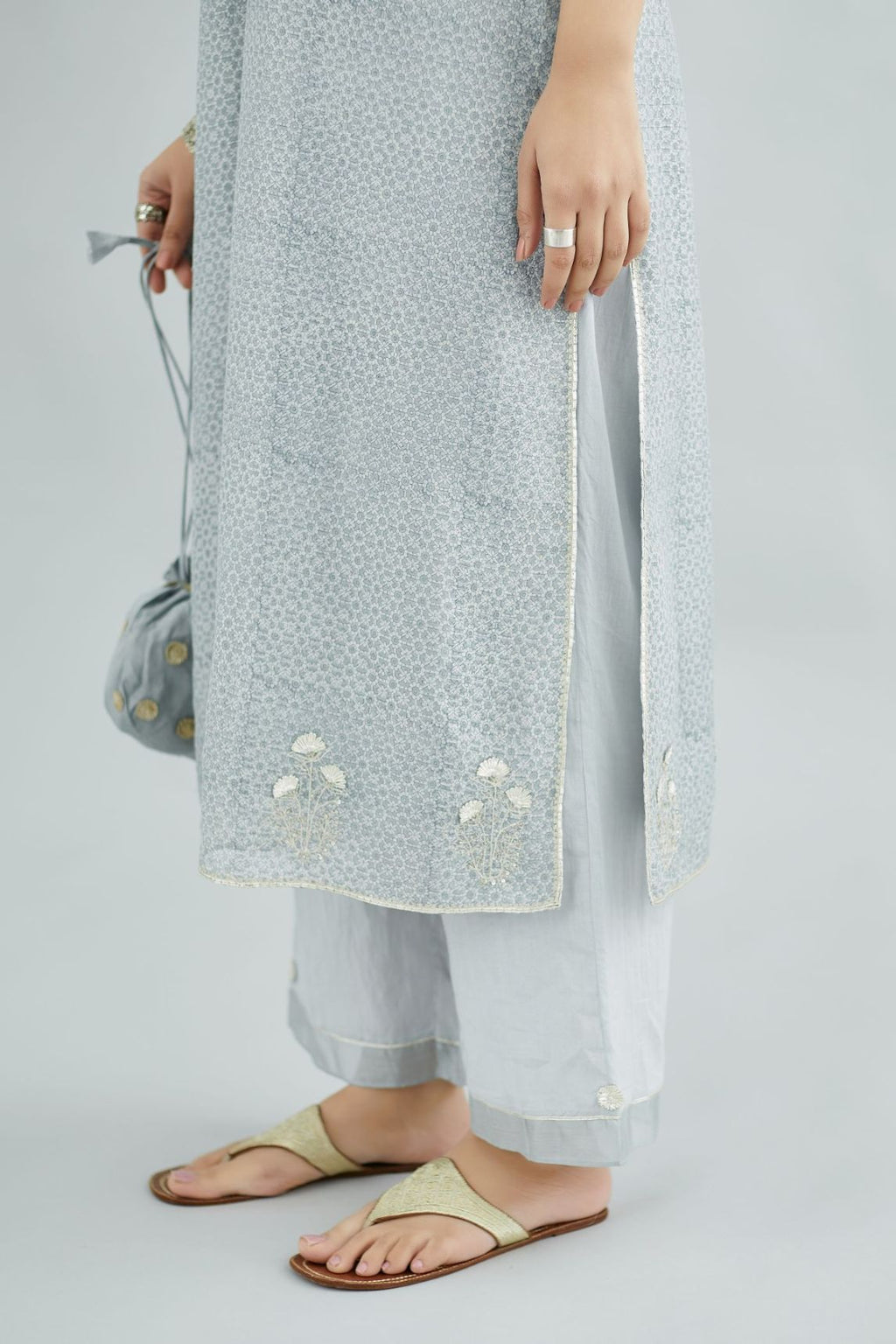 Steel blue hand block printed silk chanderi kurta with silver gota embroidery, paired with steel blue straight pants with gota and silk chanderi fabric detaling at bottom hem