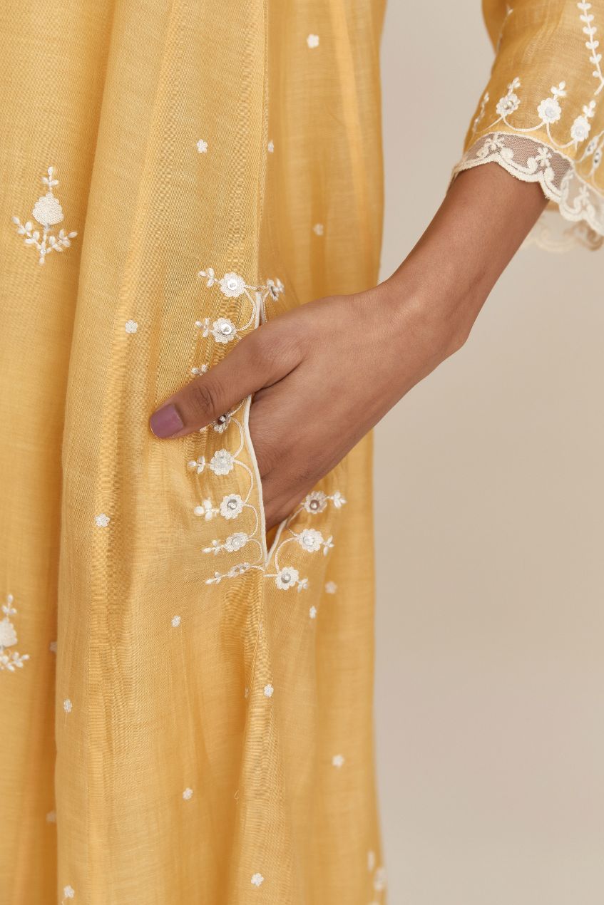 Yellow cotton chanderi short kalidar kurta set, with off white silk thread embroidery, highlighted with hand attached sequin and beads. (Kurta+Slip+Salwar+Dupatta)