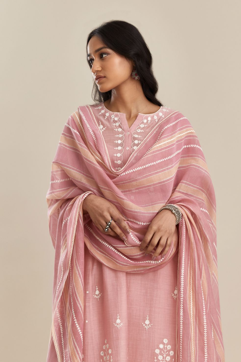 Pink cotton chanderi short kalidar kurta set, with off white silk thread embroidery, highlighted with hand attached sequin and beads.