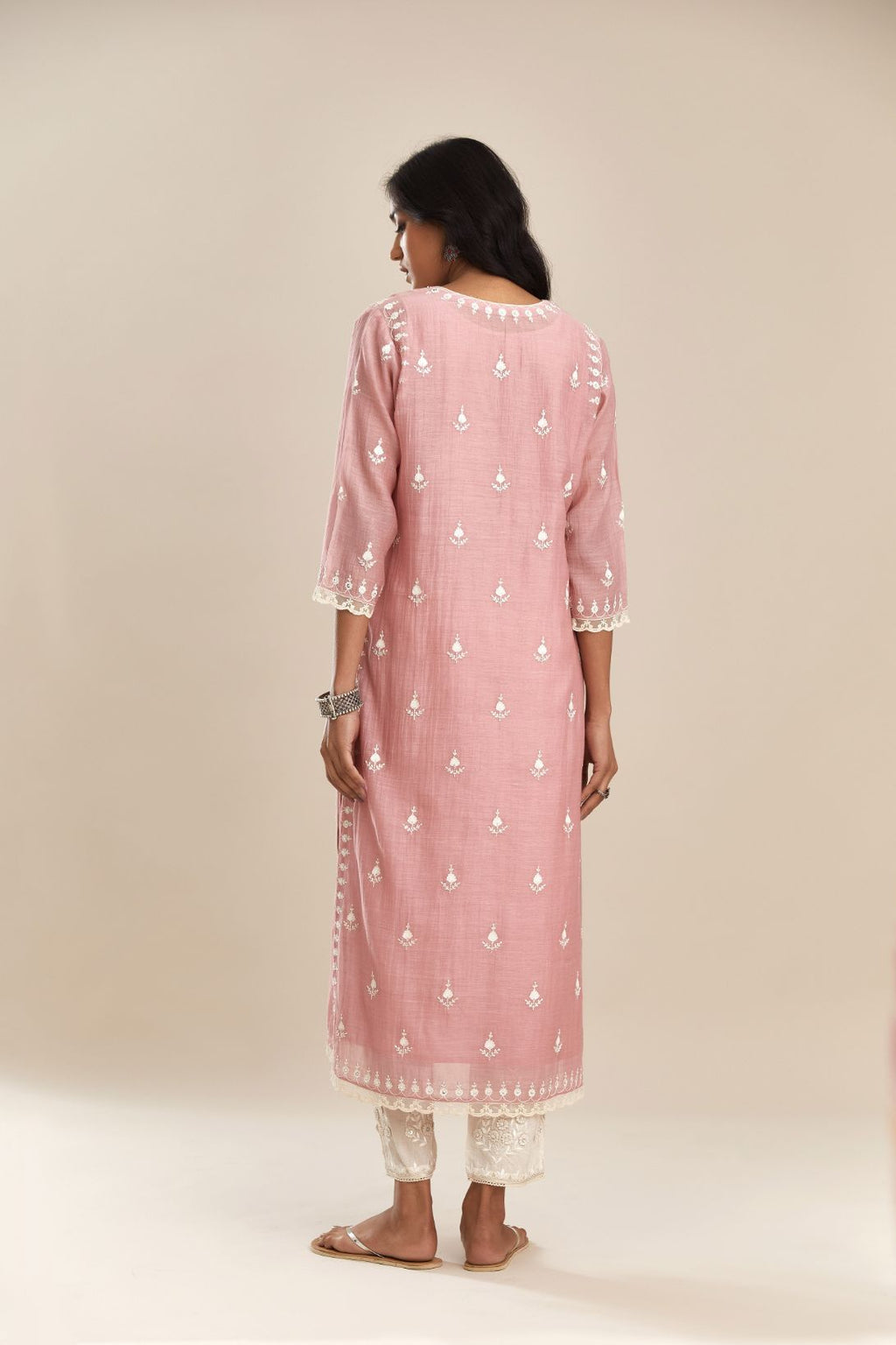 Pink cotton chanderi straight kurta set with all-over off white silk thread embroidery, highlighted with hand attached sequin and beads.