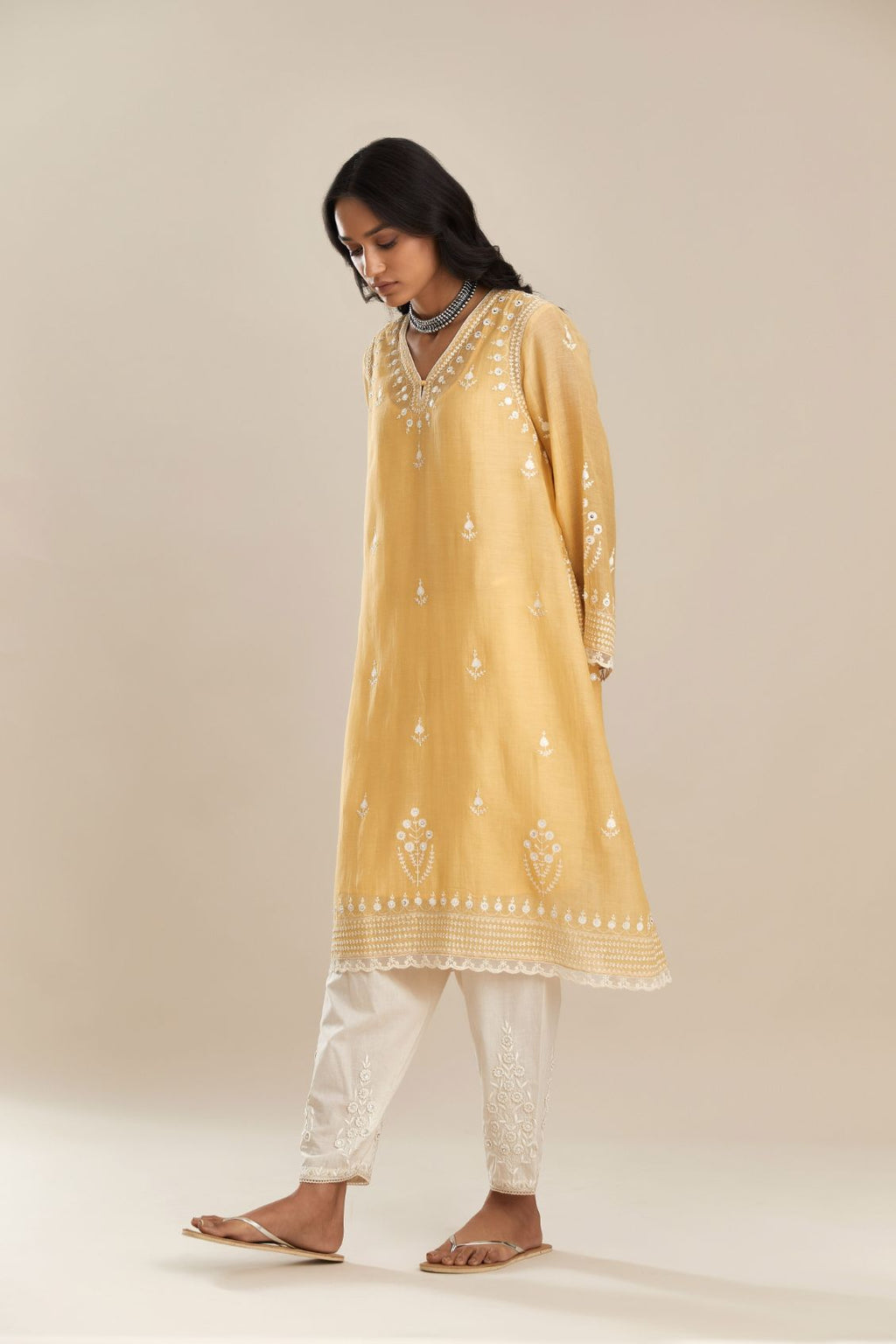 Cotton chanderi easy fit shortV neck kurta set with contrast off white silk thread embroidery, highlighted with hand attached sequin and beads.