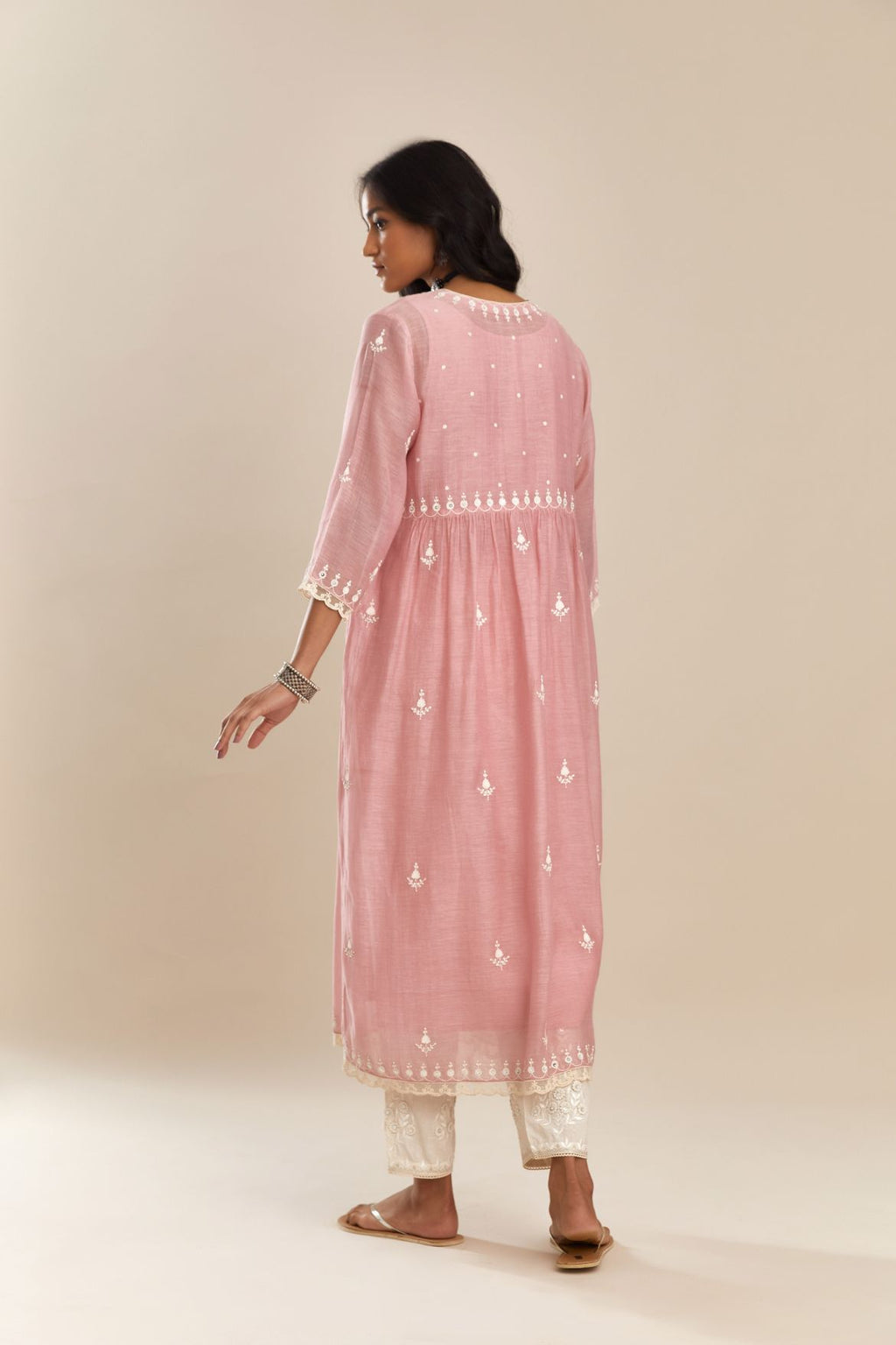 Pink cotton chanderi kurta set with off white silk thread embroidery and cotton slip inside, highlighted with hand attached sequin and beads.