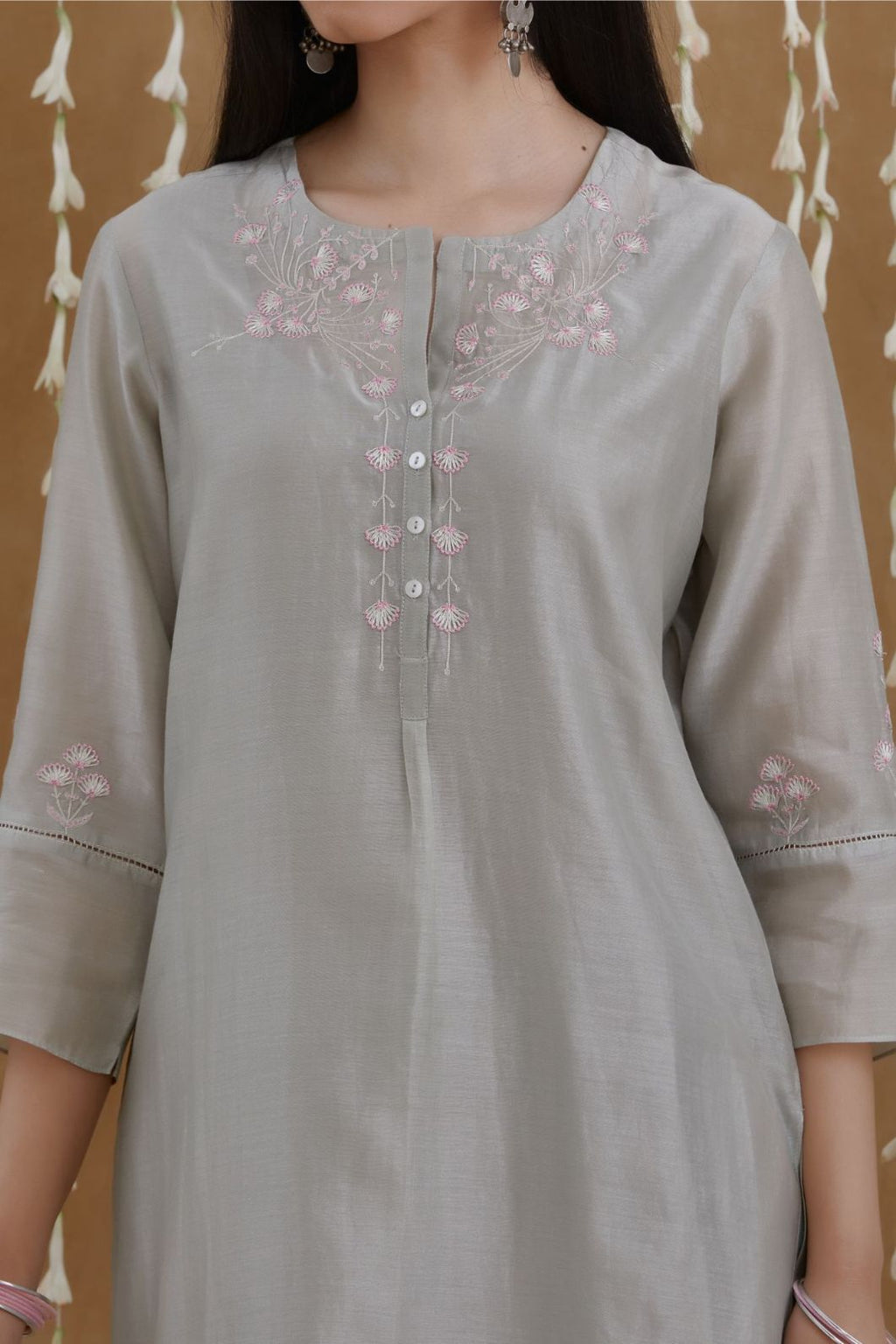 Silk Chanderi kurta set with silver zari and contrasting thread embroidery, hem and sleeves highlighted with zari faggoting