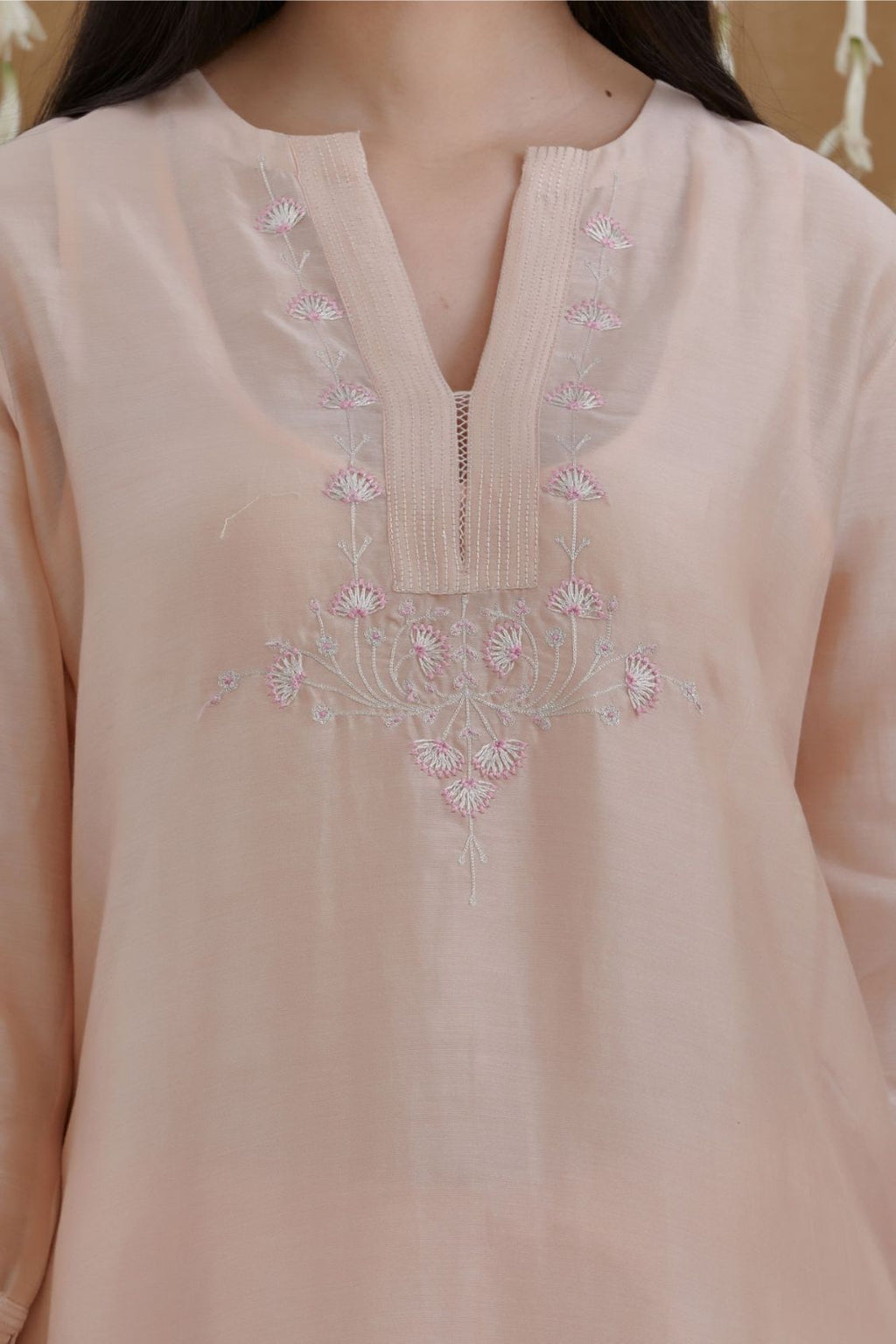 Peach silk Chanderi straight kurta set with zari and contrasting thread embroidery, highlighted with silver zari quilting