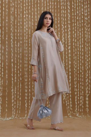 Short kalidar kurta set highlighted with silver zari and contrast coloured embroidery