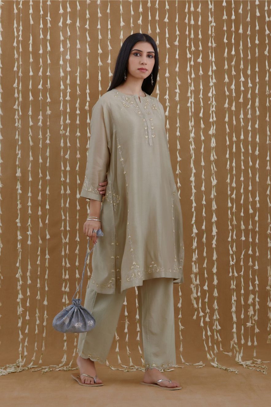 Short kalidar kurta set highlighted with silver zari and contrast coloured embroidery