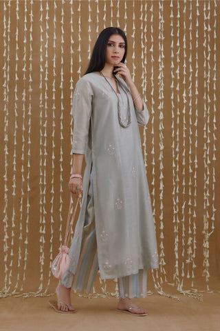 Stone blue straight kurta set highlighted with all-over silver zari and contrast coloured thread embroidery