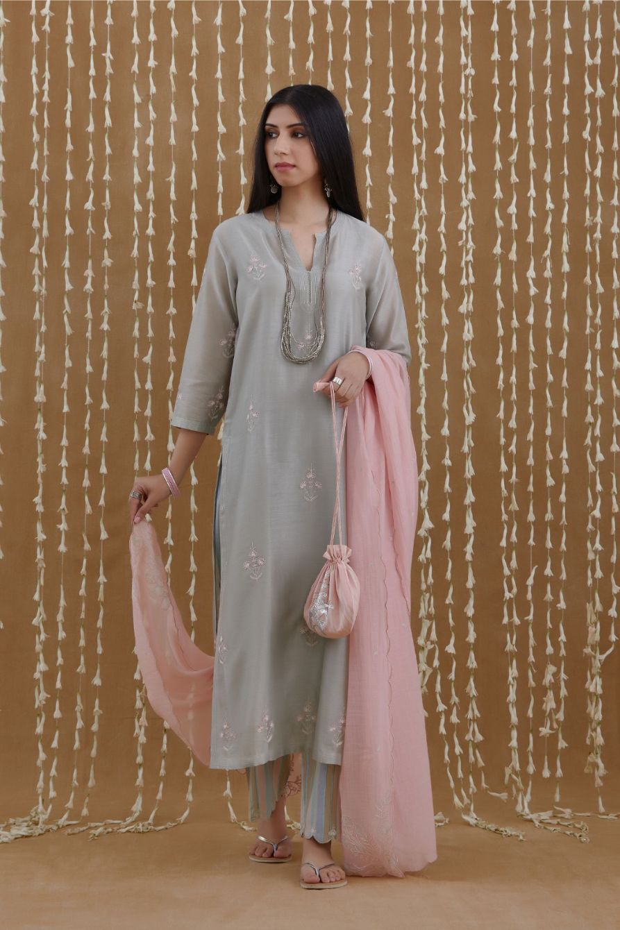 Stone blue straight kurta set highlighted with all-over silver zari and contrast coloured thread embroidery