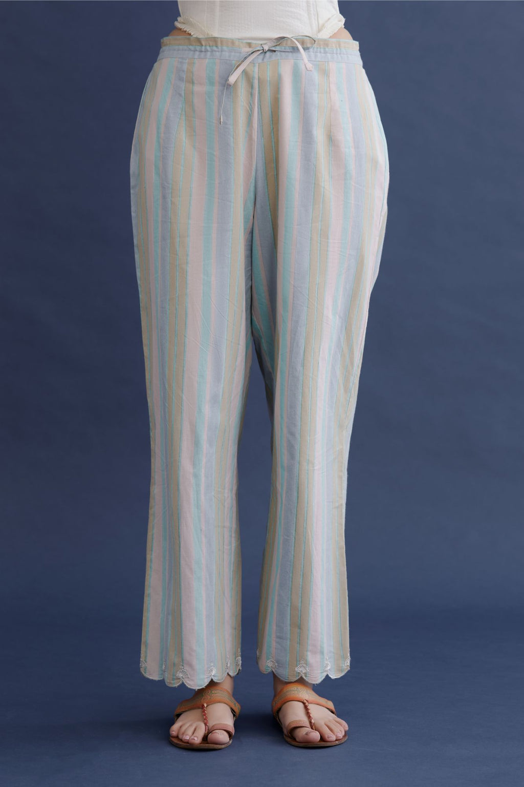 Hand block printed straight cotton pants with scalloped zari embroidered bottom hem