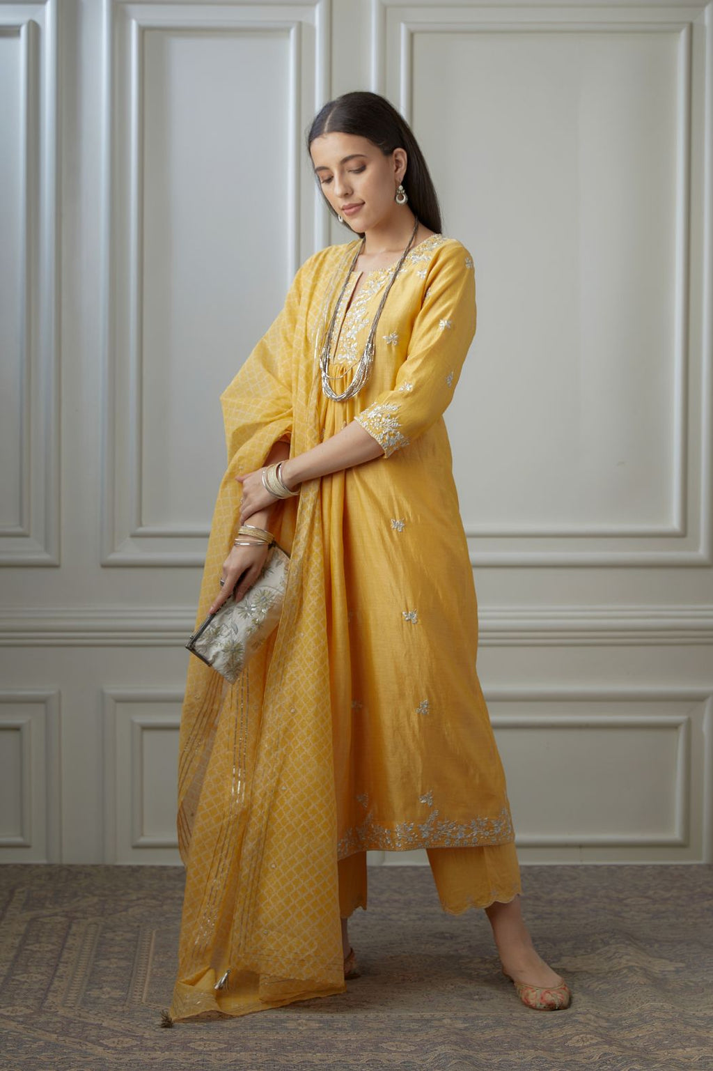 Golden yellow silver zari embroidered kurta dress set with fine gathers at waistline