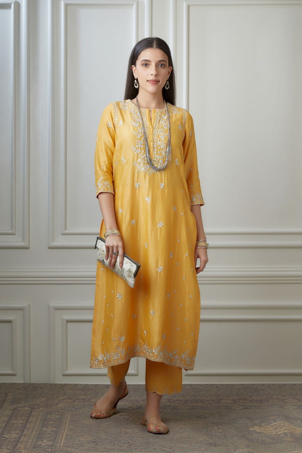 Golden yellow straight kurta set detailing with all-over silver zari embroidery and side panels