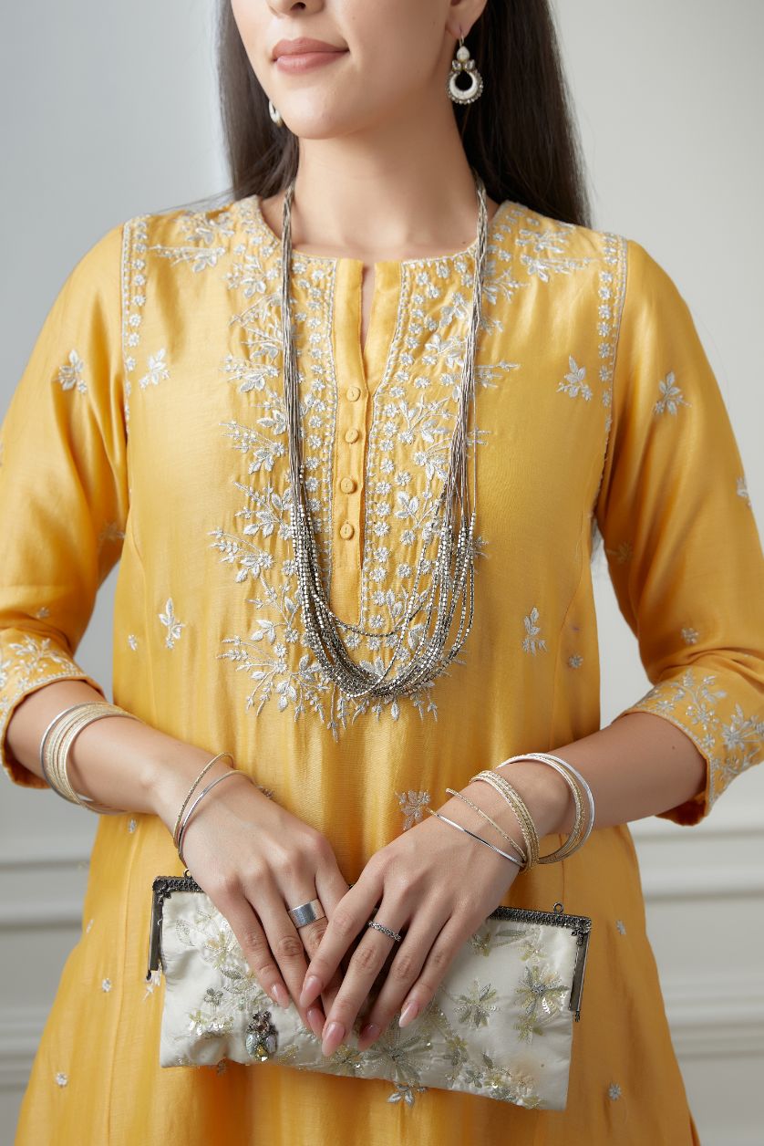 Golden yellow straight kurta set detailing with all-over silver zari embroidery and side panels