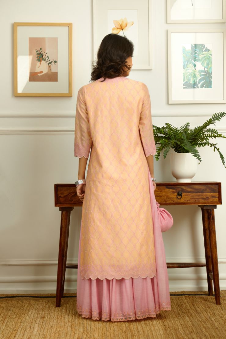 Peach Silk chanderi straight kurta set with all-over pink contrast silk thread jaal  embroidery and scalloped edges.