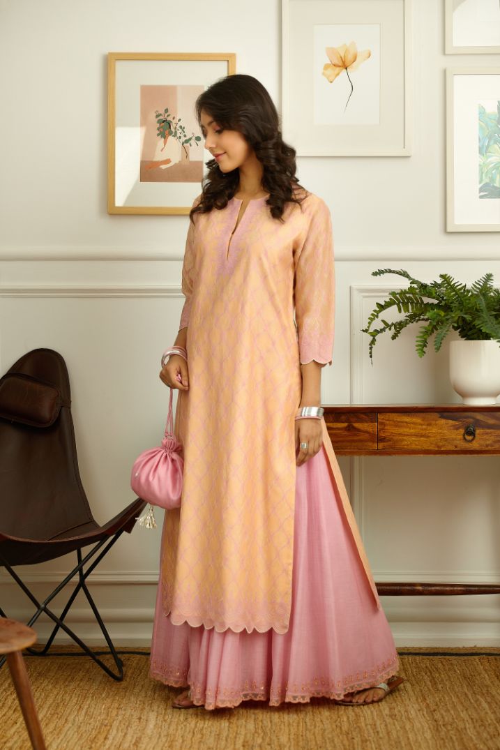 Peach Silk chanderi straight kurta set with all-over pink contrast silk thread jaal  embroidery and scalloped edges.