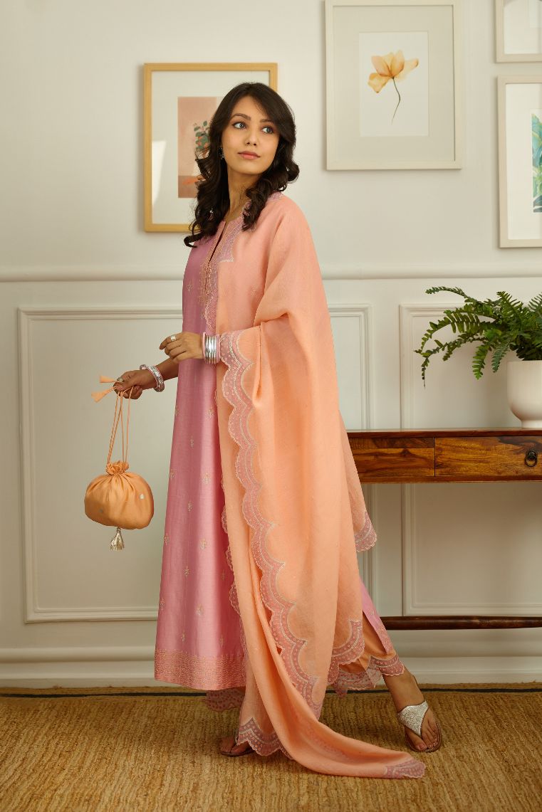 Silk Chanderi straight kurta set, lined with cotton and embroidered with orange contrast silk thread.