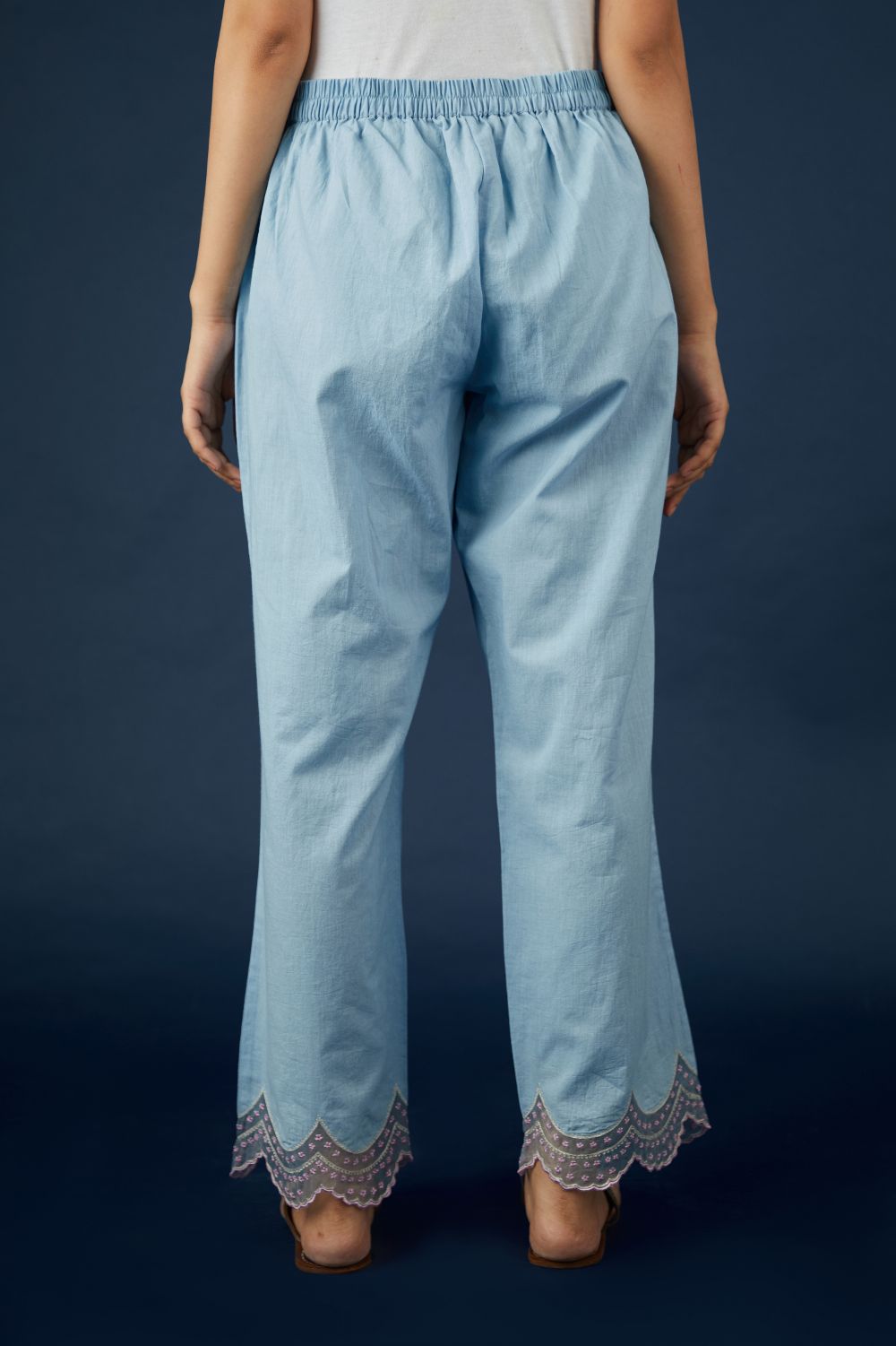 Blue straight pants with scalloped embroidery at hem. (Pants)