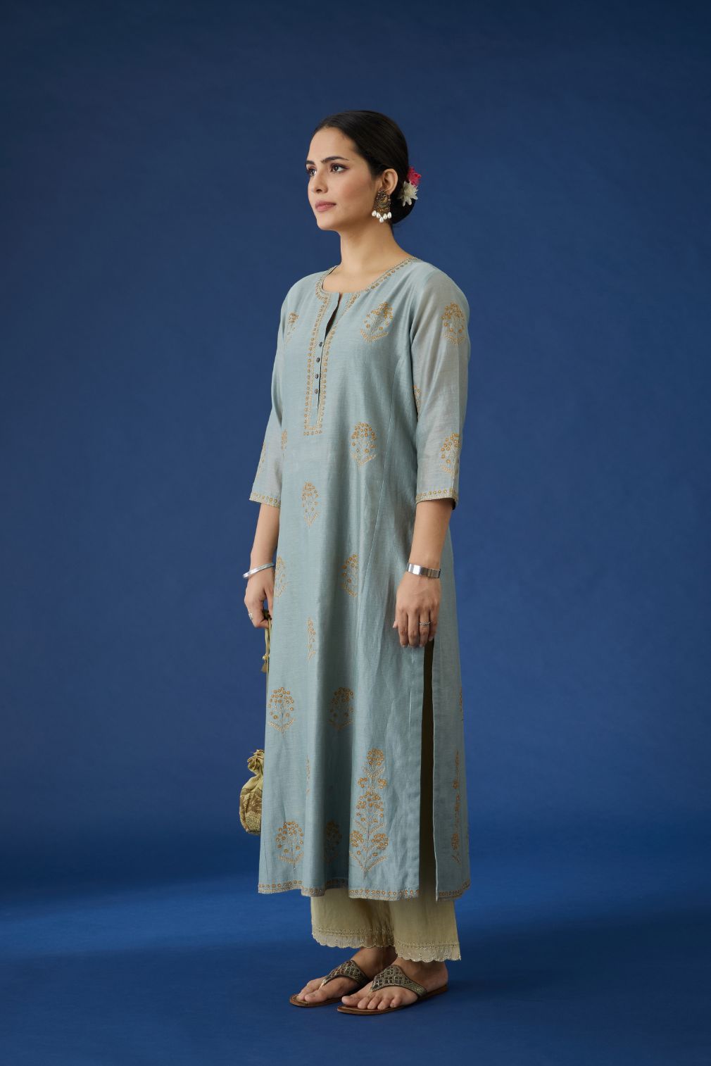 Silk chanderi kurta set with cotton lining, detailed with all-over contrast silk thread and zari embroidery.