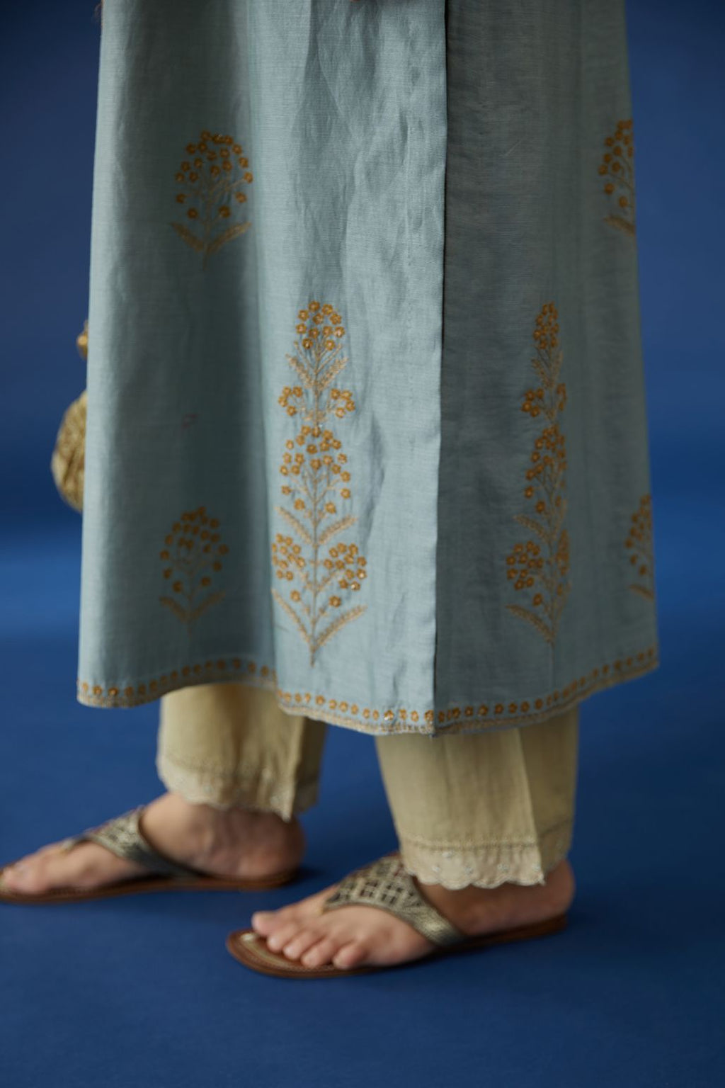 Silk chanderi kurta set with cotton lining, detailed with all-over contrast silk thread and zari embroidery.