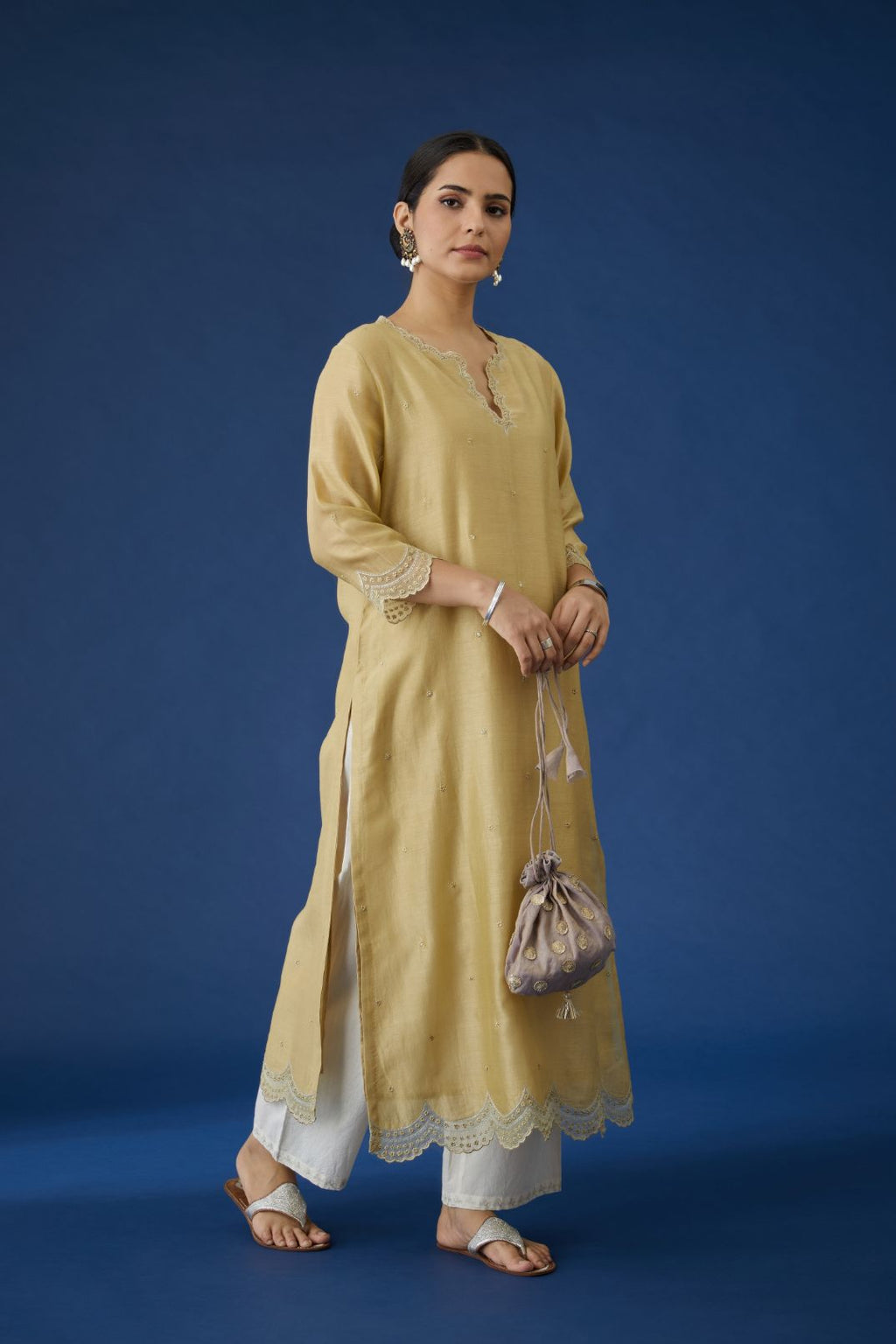 Dusty gold silk chanderi straight kurta set with scalloped hem and embroidered neckline.